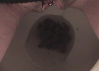 Pissing and pooping while she is sitting on the toilet