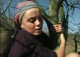 Climbing a tree while being outdoors for a fetish