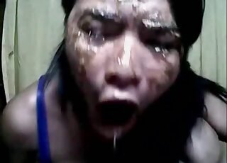 Her face is covered but she wants to eat even more