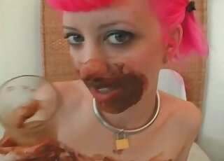 Bitch with pink hair pissing while covered in poop