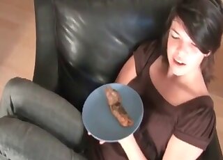 Pretty girl with a nice smile is served a plate of poo