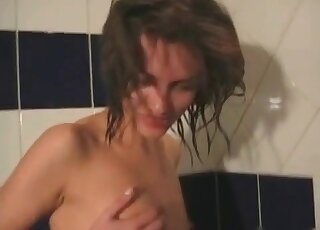 Redhead and a brunette in the shower playing together